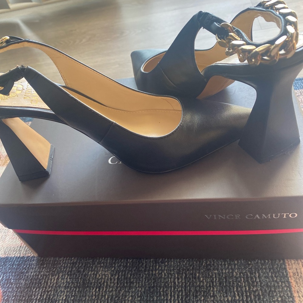 Black pumps with along back design